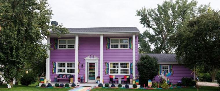 Why be boring? asks Omaha woman with purple house that’s even more colourful inside