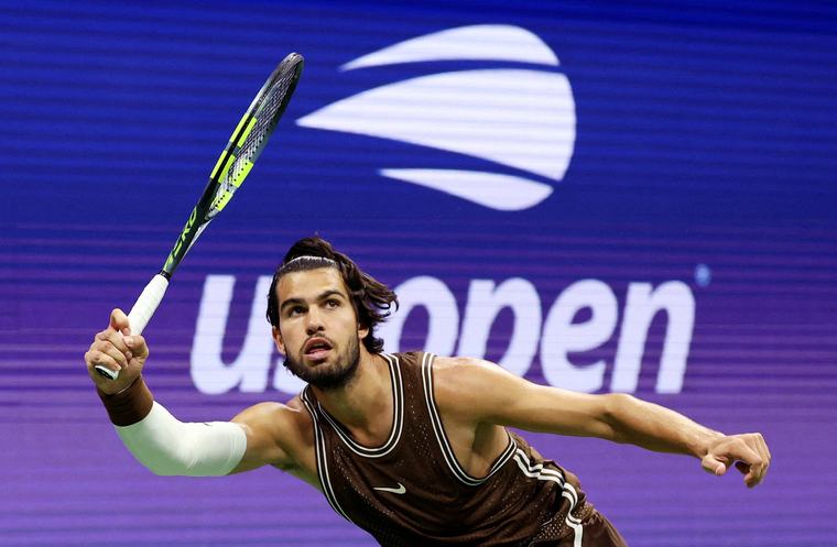 Carlos Alcaraz recovers after dropping the first set to reach the second round at the U.S. Open