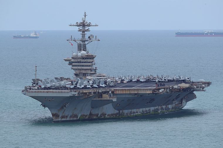 The USS Abraham Lincoln docks in Thailand after more than nine months at sea