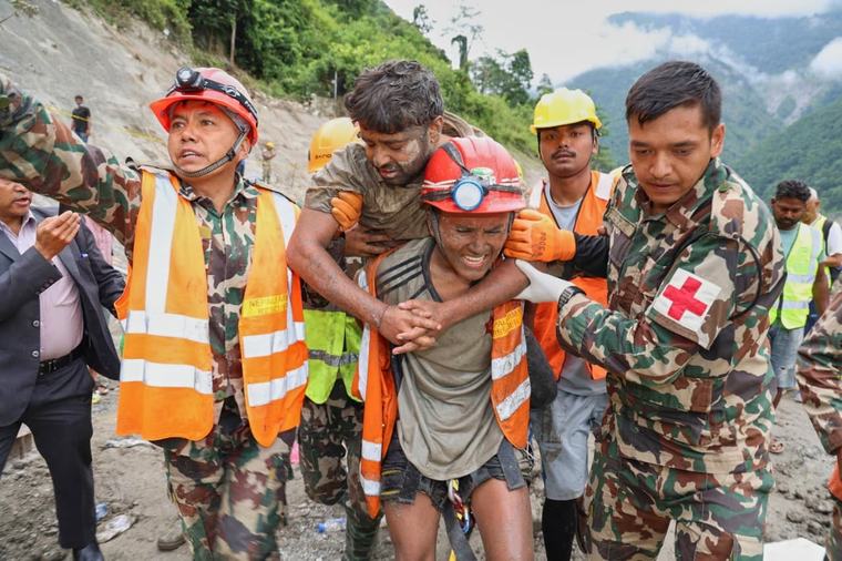 Two workers rescued nine days after Nepal floods trapped them in tunnel